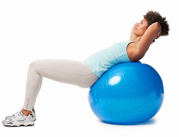 istock Woman Doing Crunches on a Balance Ball 155148255