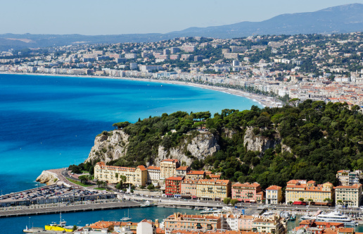 Nice, France - August 3, 2022: Nice panorama with Riquier, Cimiez and Saint Roch historic old town districts with Alpes mountains at French Riviera of Mediterranean Sea