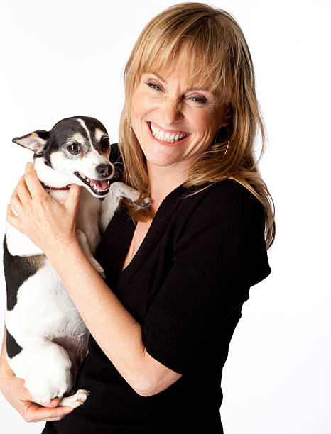 istock happy woman with her dog 155148495