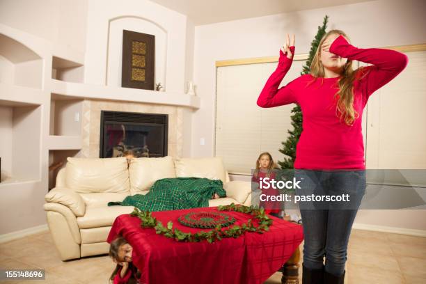 Babysitter Does Holiday Countdown To Chase Of Hide Stock Photo - Download Image Now - 10-11 Years, 16-17 Years, 18-19 Years