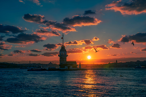 Awesome sunset at Maiden Tower. An iconic landmark on Istanbul's skyline, the Maiden's Tower has a rich history dating back to the fourth century, as well as a few legends.