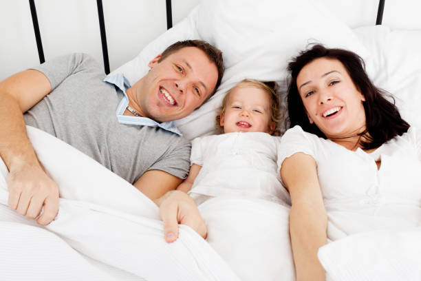 istock Young family in bed 155148753