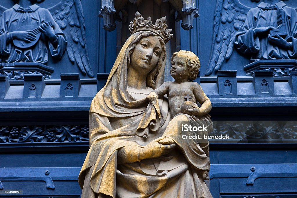 Virgin Mary with baby Jesus Old statue of Virgin Mary with baby Jesus outside the Dominican Church in Colmar, Alsace, France. Virgin Mary Stock Photo