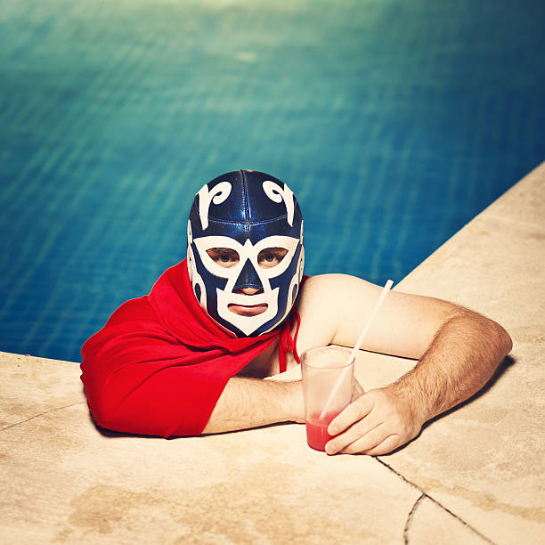 mexican luchador in piscina - wrestling mask foto e immagini stock