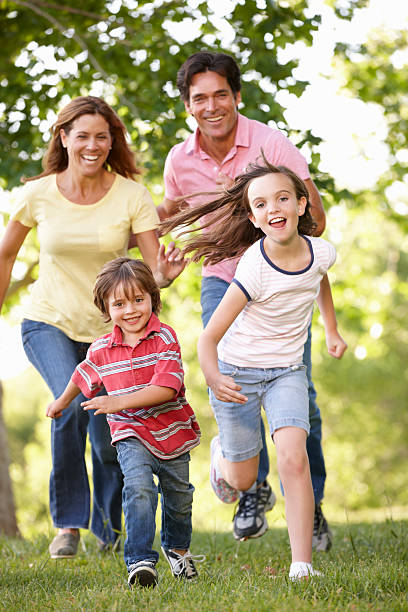 istock Happy family running in the park 155148973