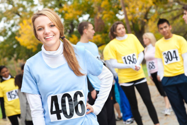 istock Young girl smiling before a charity race begins 155149003