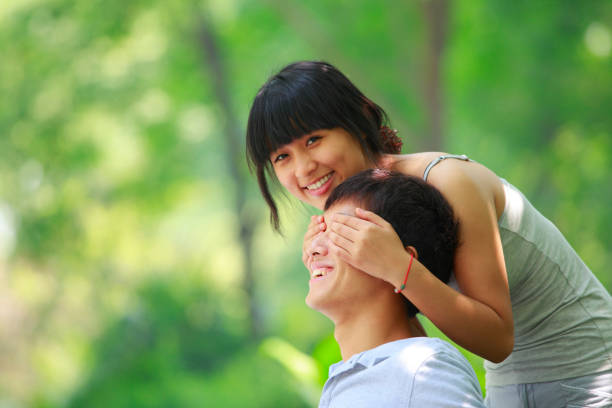 istock happy young couple together in the park 155149283