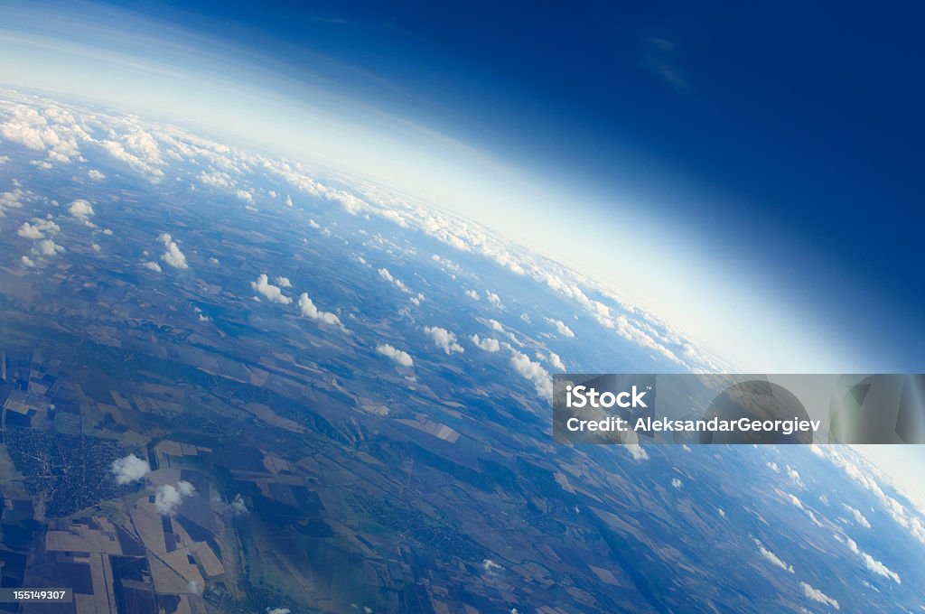 View of Planet Earth Aerial view of Planet Earth with clouds, horizon and little bit of space, make feelings of being in heaven. Cloudscape and stratosphere from above at 30000 feet. Planet Earth Stock Photo