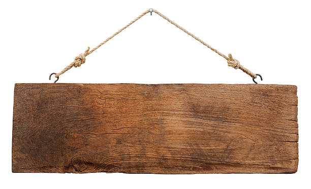 Old weathered wood signboard. Old weathered wood signboard, hanging by old rope from a nail, isolated on white, clipping path included. rustic stock pictures, royalty-free photos & images