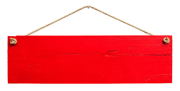 Old red weathered wood signboard.