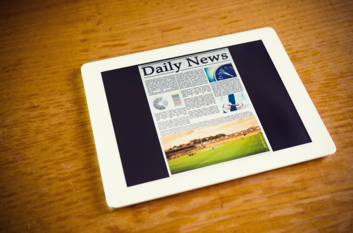 Bogus newspaper with fake articles shot on white background with clipping path