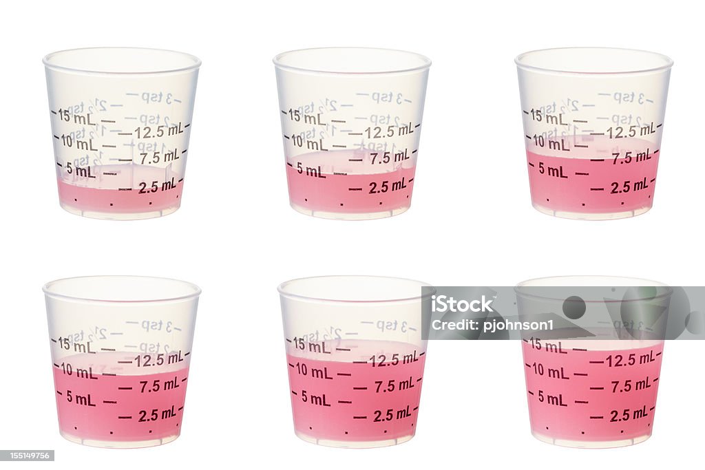 Kids medicine Graduated measuring cups composed into 1 shot with 2.5ML, 5ML, 7.5ML, 10ml, 12.5ML and 15ML containing kids medicine.  Larger files include clipping path.  Professionally shot, color corrected, exported 16 bit color and retouched for maximum image quality. Child Stock Photo
