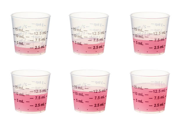 Kids medicine Graduated measuring cups composed into 1 shot with 2.5ML, 5ML, 7.5ML, 10ml, 12.5ML and 15ML containing kids medicine. Larger files include clipping path. Professionally shot, color corrected, exported 16 bit color and retouched for maximum image quality. child liquid medicine stock pictures, royalty-free photos & images