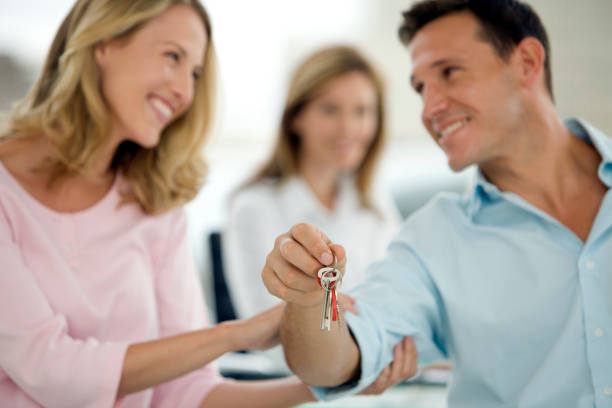 istock Couple holding home keys 155149824