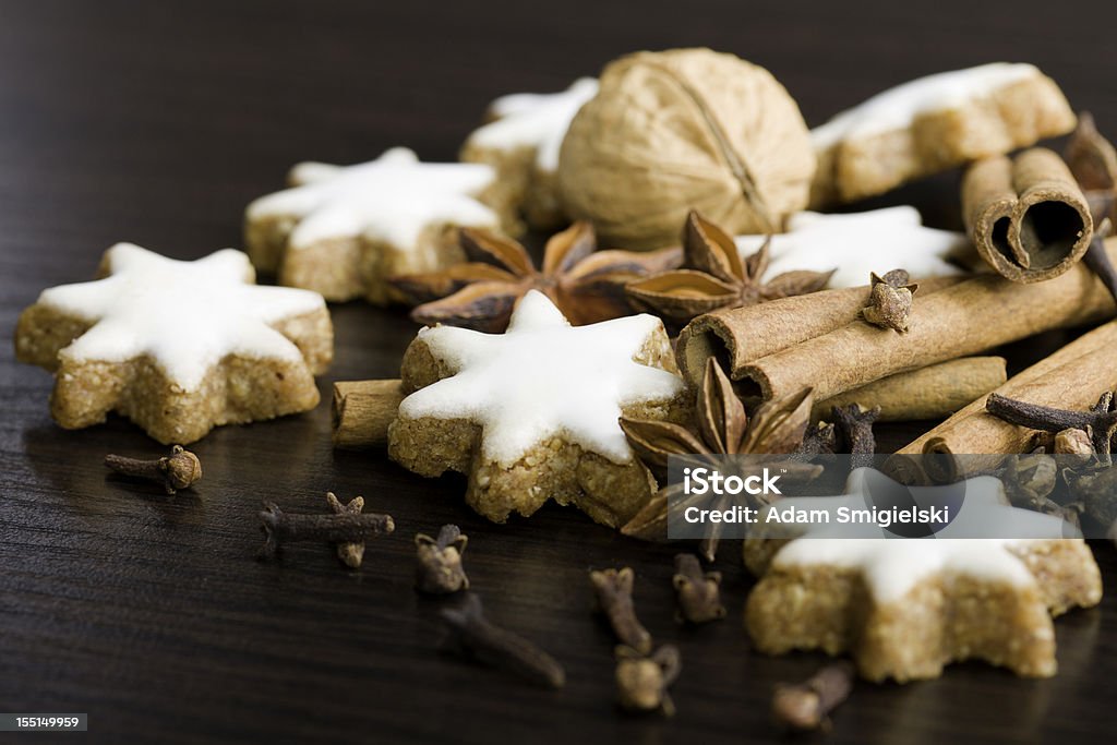 gingerbread cookies,nuts and spices gingerbread cookies, nuts, cinnamon sticks, anise, walnut and cloves on wooden table Anise Stock Photo