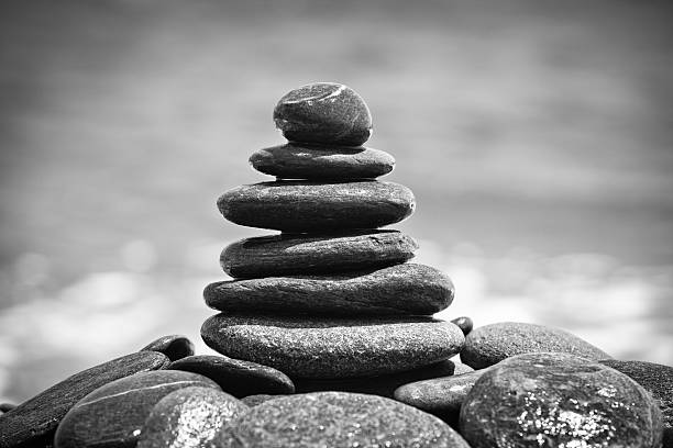 istock Tall pile of pebbles stacked on the beach 155150150