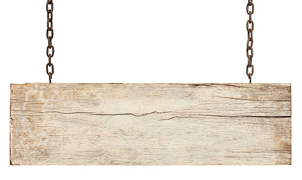 Old piece of white weathered wood signboard. Old piece of white weathered wood signboard hanging by rusty chains, isolated on white,clipping path included. driftwood photos stock pictures, royalty-free photos & images