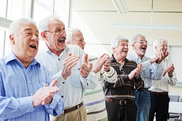 istock Group of senior men applauding 155150651