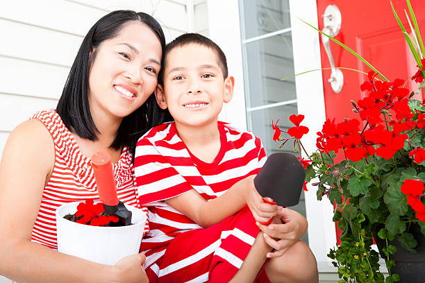 istock Mother and son gardening 155150887