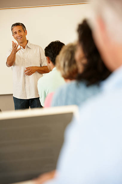 istock Teacher and mature students in class 155150904