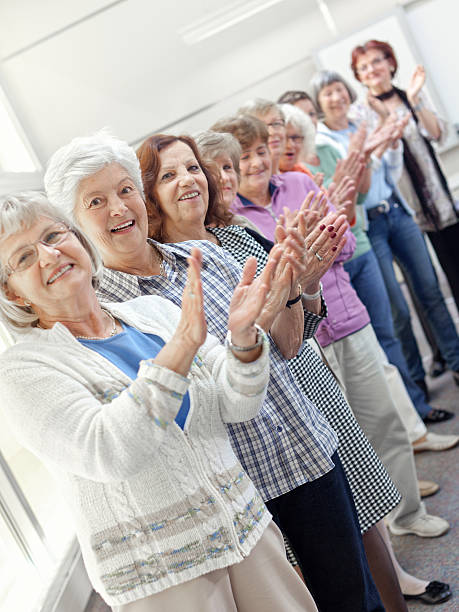 istock Group of senior women applauding 155151038