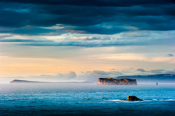 drangey island during midnight sun, northern iceland; drangey is the place of the classic Grettis saga