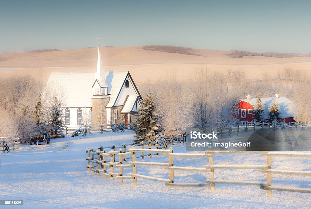 Small Country Church in Winter A little church in the country in winter. Wedding chapel. Alberta, Canada, Rural scenic. Themes in the image include Christmas, magical, idyllic, scenic, rural, barn, village, quaint, church, chapel, snow, cold, January, frost, serene, beauty, alberta, frosty, winter day, landscape, scenic, southern alberta, Canada. Nobody is in the image.  Winter Stock Photo