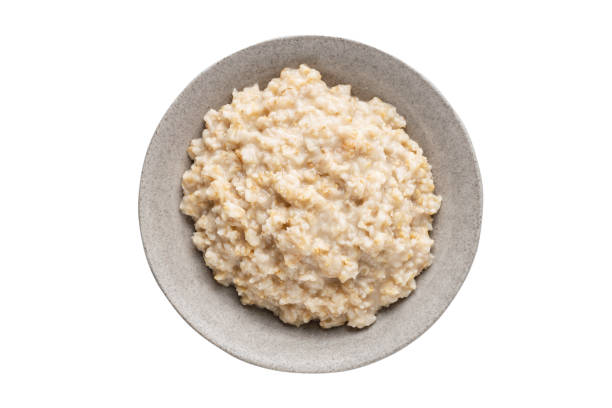 istock Bowl of cooked oatmeal isolated 1551513504