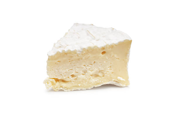 A piece of Camembert on a white background