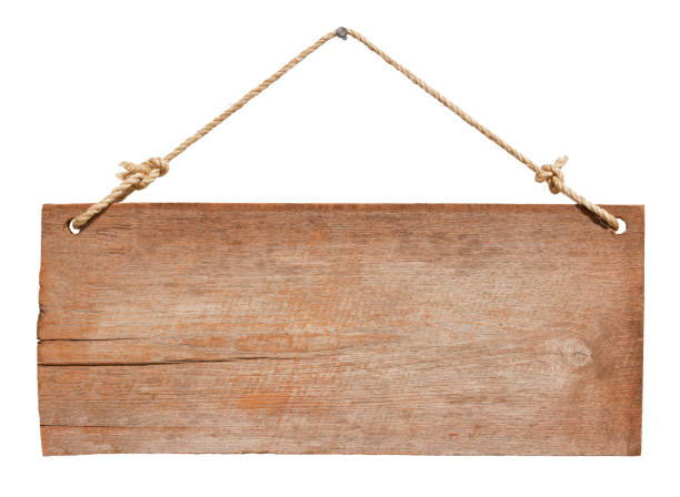 Old weathered wood signboard. Old weathered wood signboard, hanging by old rope from a nail, isolated on white, clipping path included. hanging signboard stock pictures, royalty-free photos & images