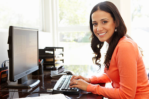 istock Hispanic woman working in home office 155151699