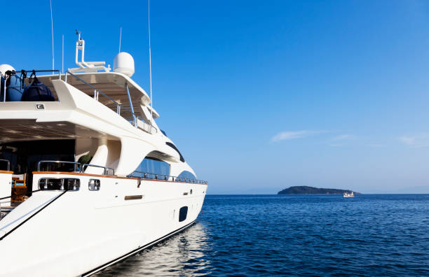 Yacht in the islands. Perfect shape. Summer sky.
