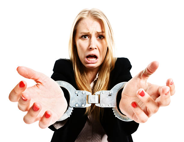 handcuffed protestant tearfully jeune femme d'affaires - pleading women business sadness photos et images de collection