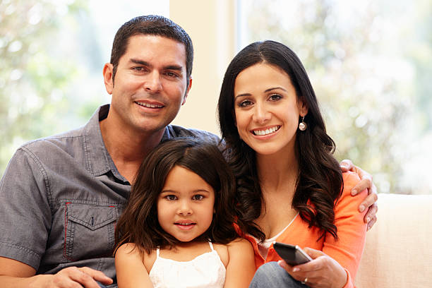 Hispanic family watching television