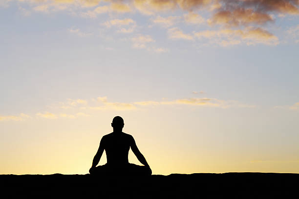 istock meditating man against sky Gran Canary Spain 155152274