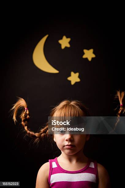 Serious Redhaired Girl Wearing Upward Braids With Moon And Stars Stock Photo - Download Image Now