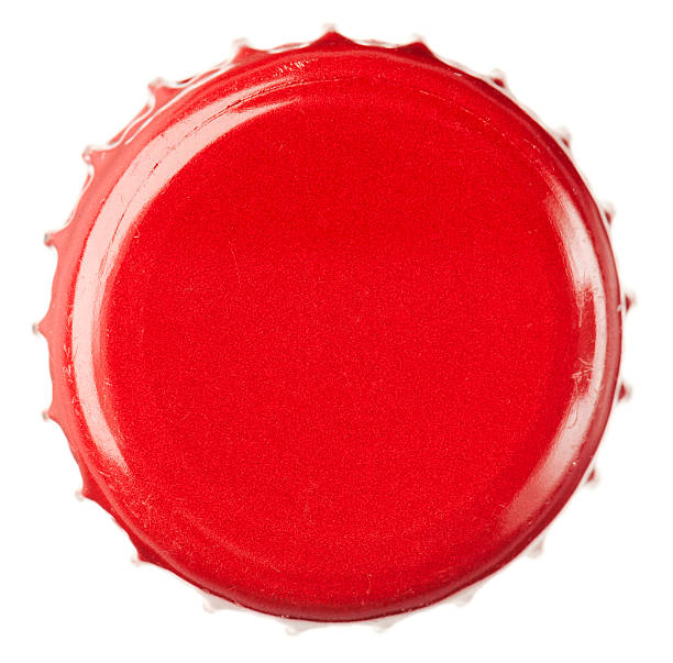 Red Bottle Cap Close-Up Macro image of a red, metal bottle top. bottle cap stock pictures, royalty-free photos & images