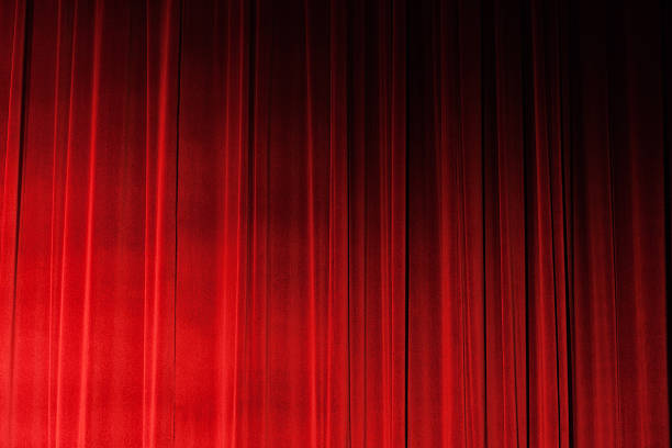 istock Sidelit closed ruched red velvet theatre drapes 155152517