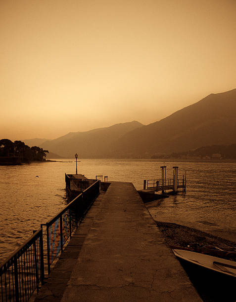 pier and mountains at Bellagio town located in the Como Lake - Italy