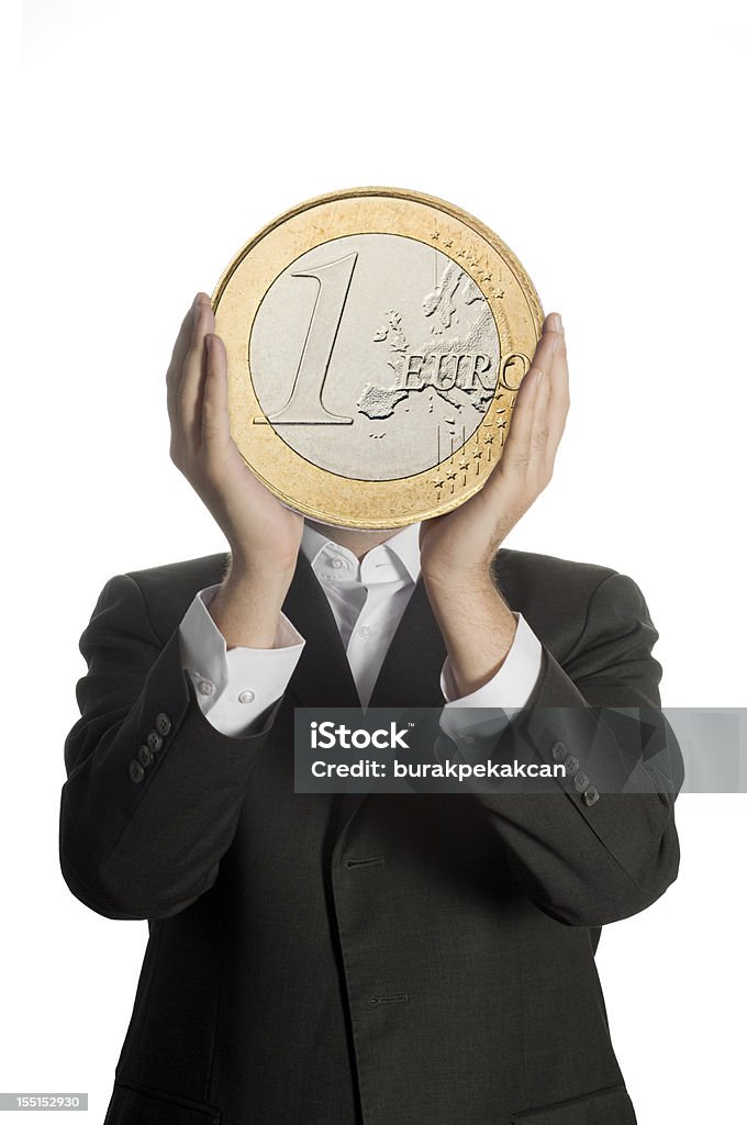 Uomo d'affari tenendo una moneta euro - Foto stock royalty-free di Moneta