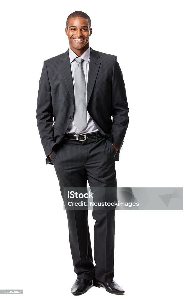 Vertical shot of a man with a white background Portrait of a handsome young businessman standing with his hands in his pockets. Vertical shot. Isolated on white. Men Stock Photo