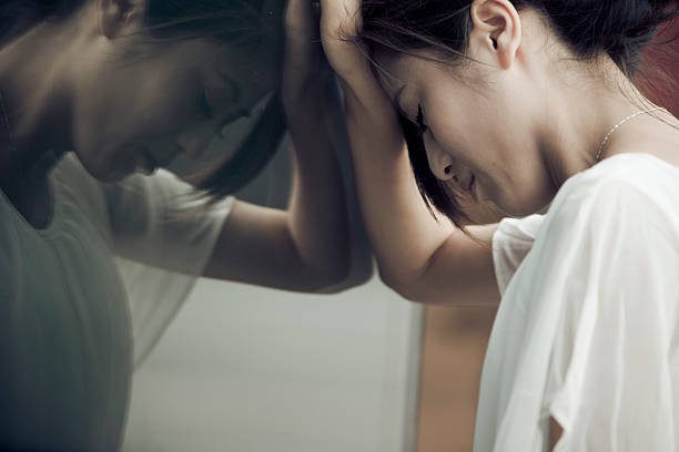 stressed businesswoman  leaning on the wall