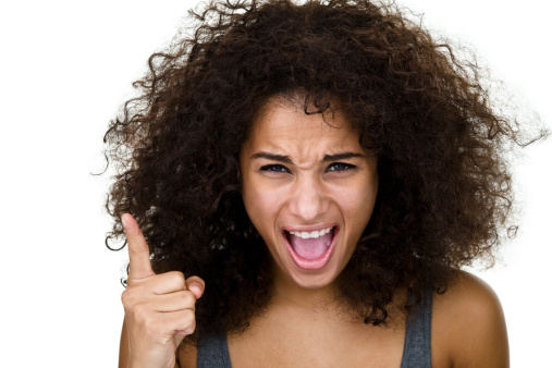 Angry mixed race woman yelling at viewer and isolated on white background 