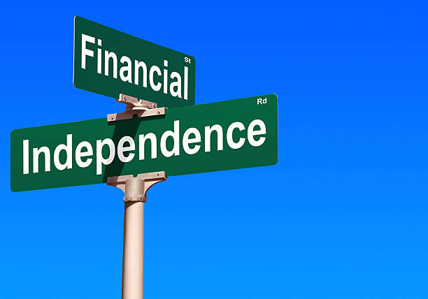 Financial Independence Street Sign financially independent stock pictures, royalty-free photos & images