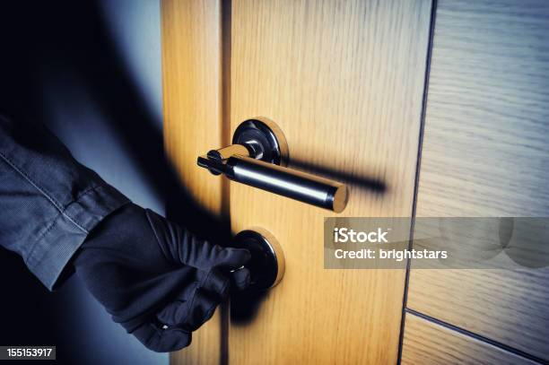 Gloved Hand Opening The Door Stock Photo - Download Image Now - Thief, Door, Burglar