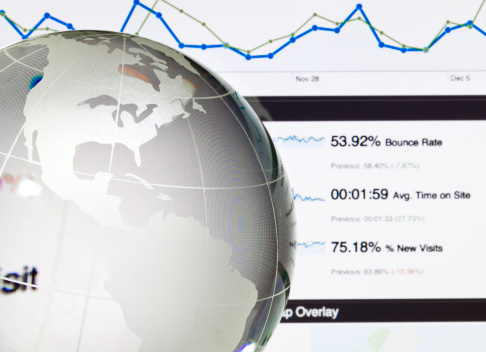 Google analytics of website traffic behind glass globe. Click to see more!