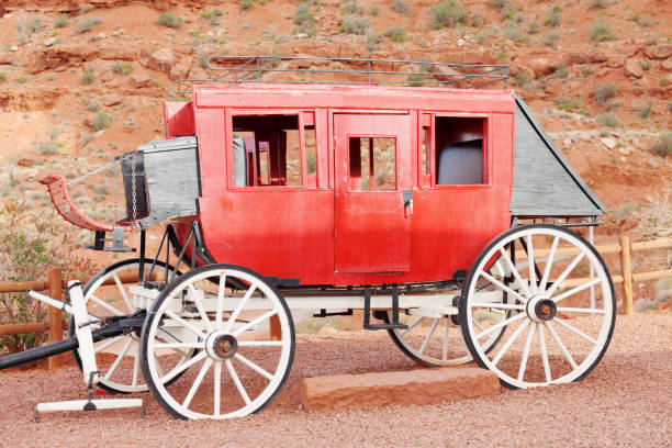 istock sideview of a red wild west wagon in Monument Valley 155154191