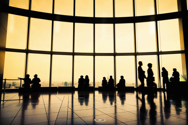 istock Backlit People Silhouettes Modern Architecture City View 155154292