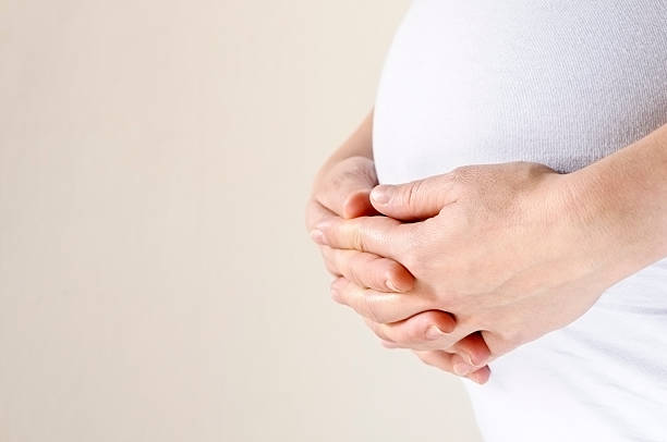 istock Pregnant Woman Holding Her Belly 155154555