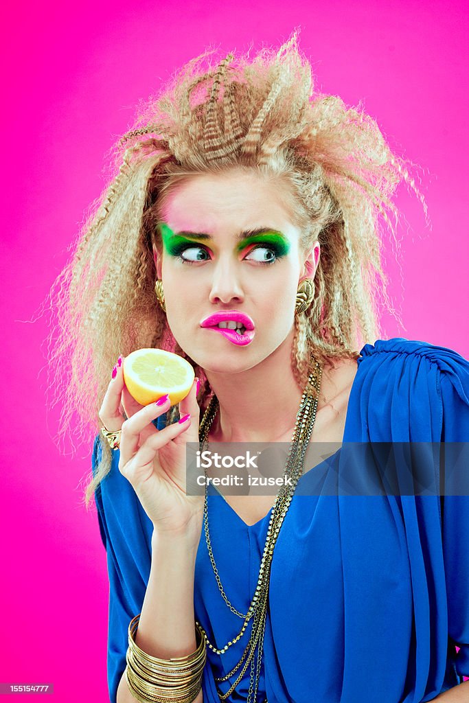 80s style girl with lemon  1980 Stock Photo